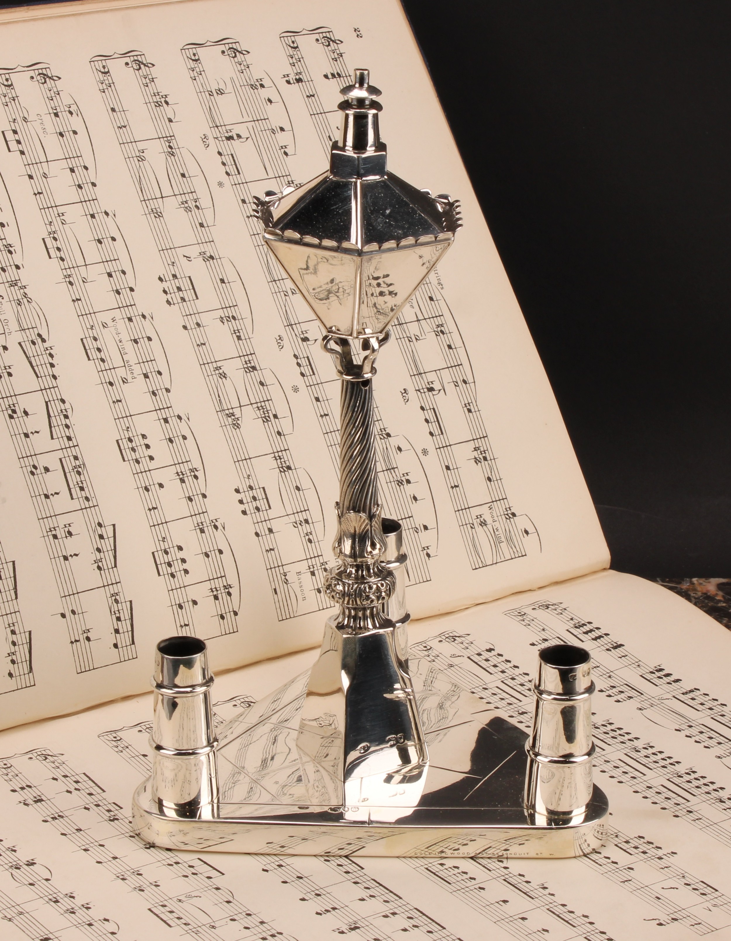 A Victorian silver novelty table centre cigar lighter, as a street lamp, the triform base with three