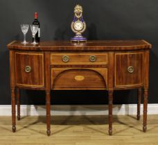 A George III mahogany sideboard or serving table, satinwood crossbanded top above a frieze drawer