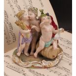 A Meissen figure group, The Four Seasons, as four revelling putto, each with symbols of the seasons,