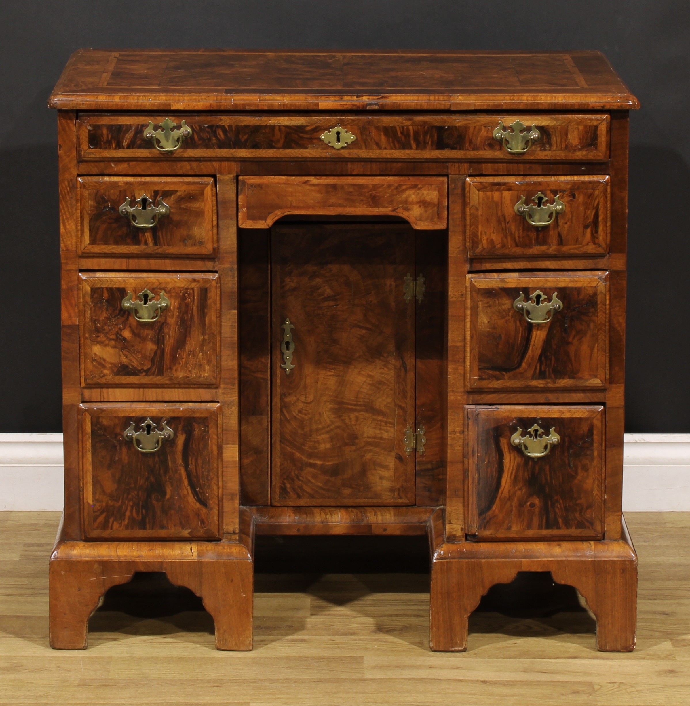 A George II featherbanded walnut kneehole desk, rectangular top with moulded edge above an - Image 2 of 6