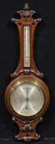 An Art Nouveau oak wheel barometer, 19.5cm circular silvered register inscribed ROSS, the shaped