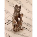 An Elizabeth II silver novelty miniature model, cast as a cat playing a cello, 6cm high