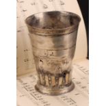 A large German silver tapered cylindrical beaker,fluted band above a skirted base, 15cm high,