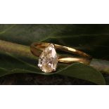 An 18ct gold diamond solitaire ring, pear cut diamond, size O/P, marked .99ct, 2.68g