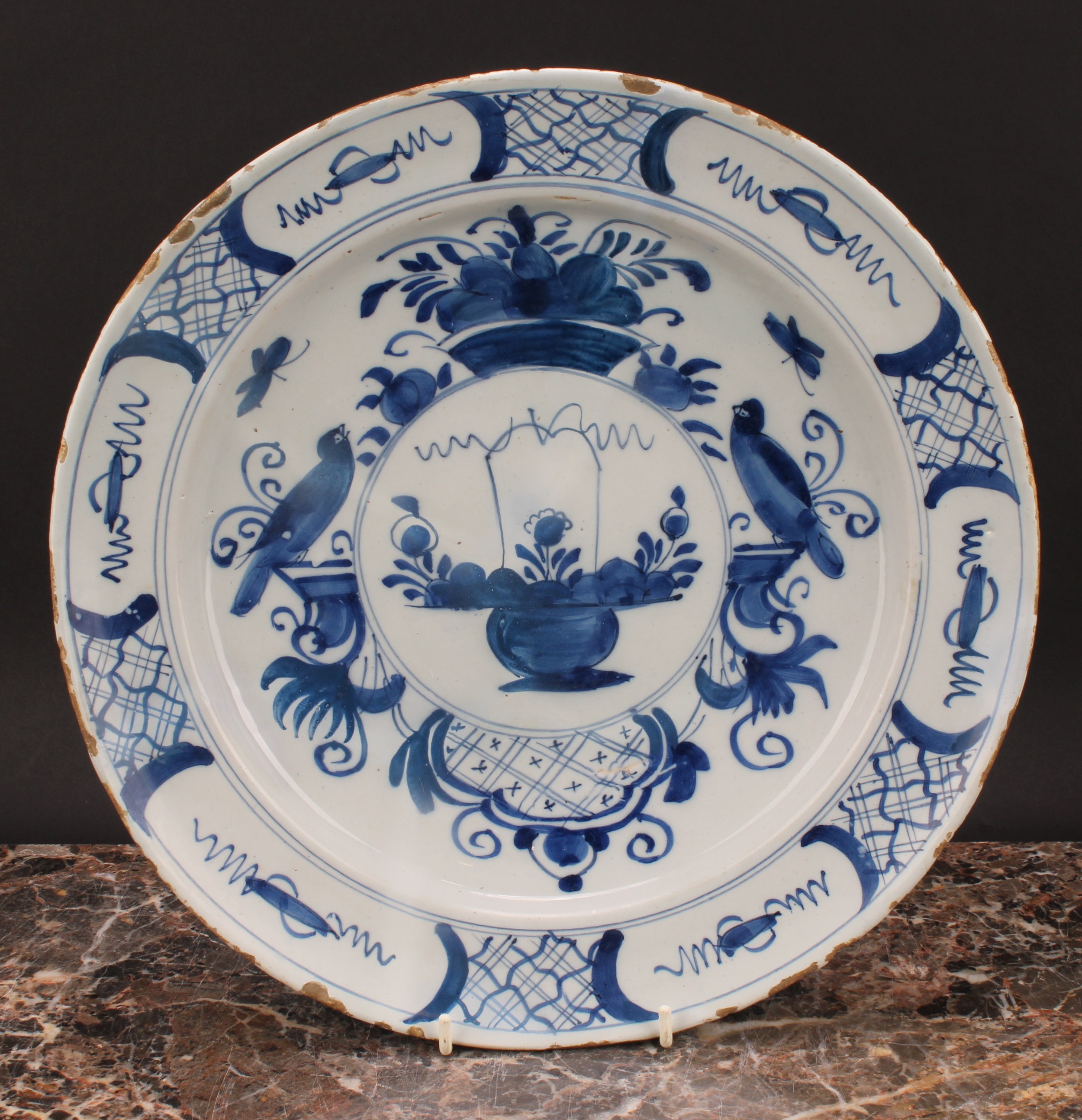 An 18th century Delft circular charger, painted in underglaze blue in the Chinese taste, with - Image 2 of 3