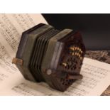 A 19th century rosewood concertina, twenty one bone keys, hexagonal fretwork ends, 16cm wide,