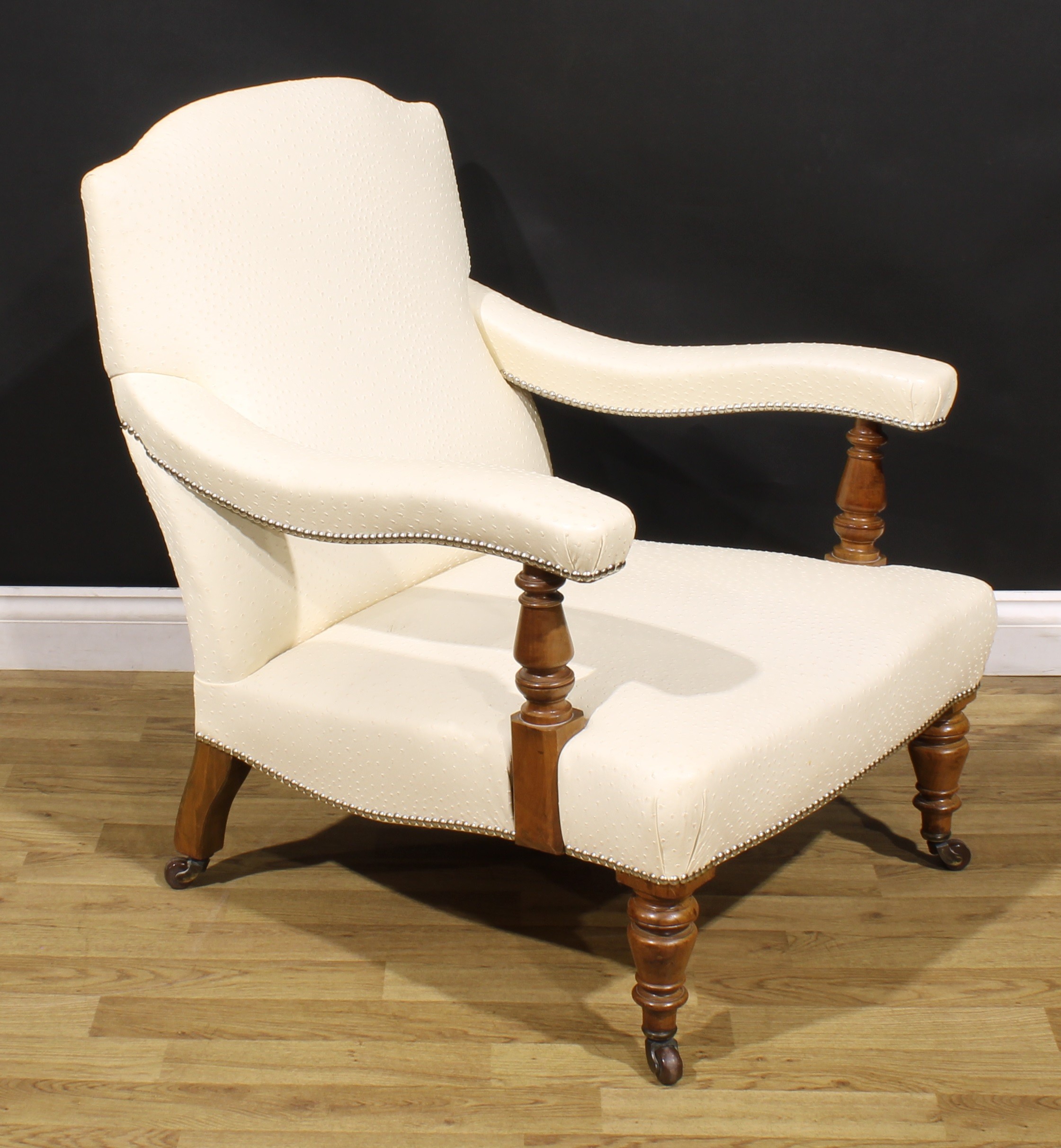 A Victorian walnut easy chair, in the manner of Howard & Sons, stuffed-over ostrich hide upholstery, - Image 2 of 4