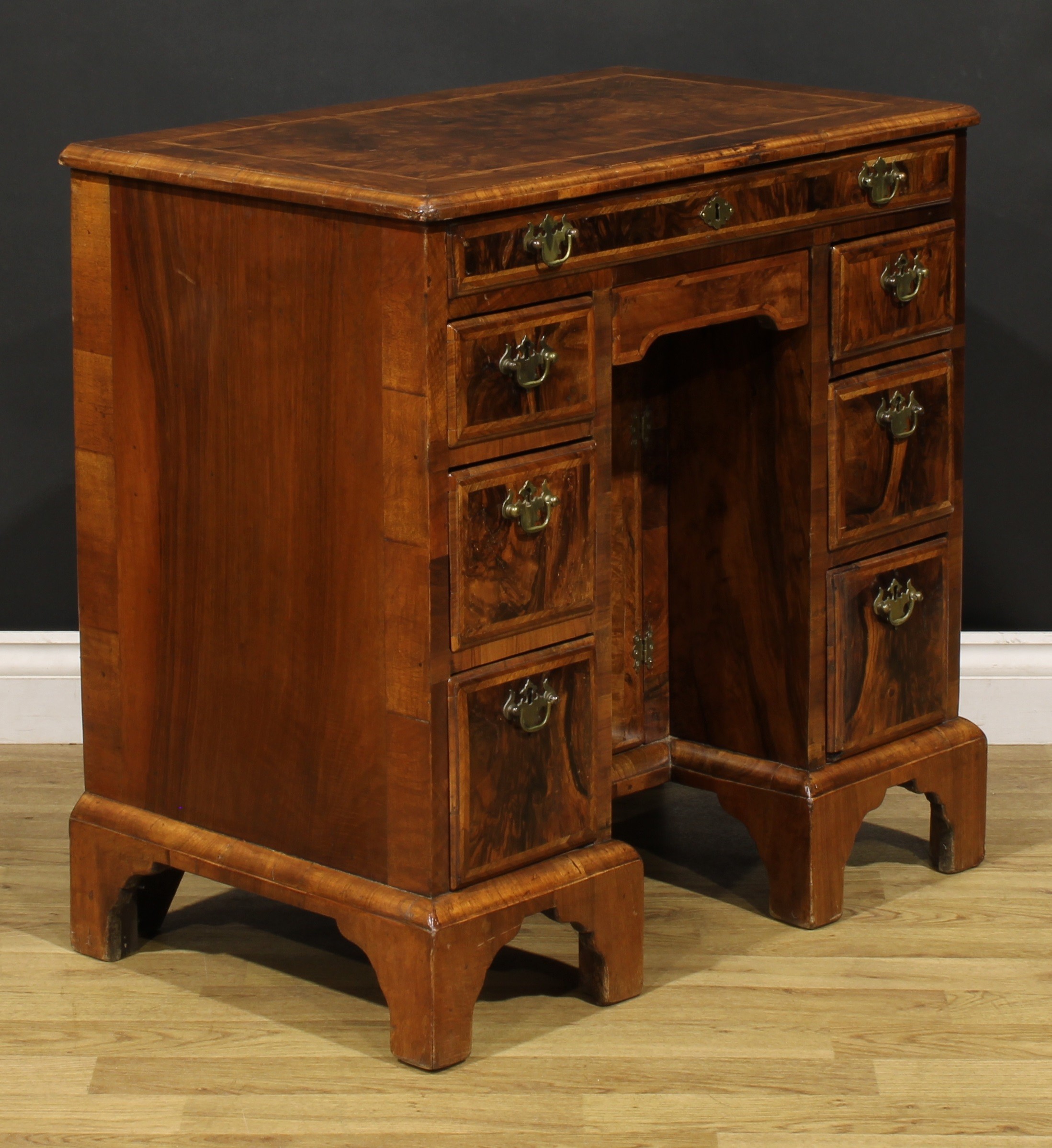 A George II featherbanded walnut kneehole desk, rectangular top with moulded edge above an - Image 3 of 6