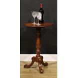 An Aesthetic Movement period elm tripod wine table, circular tilting top, turned pillar, cabriole