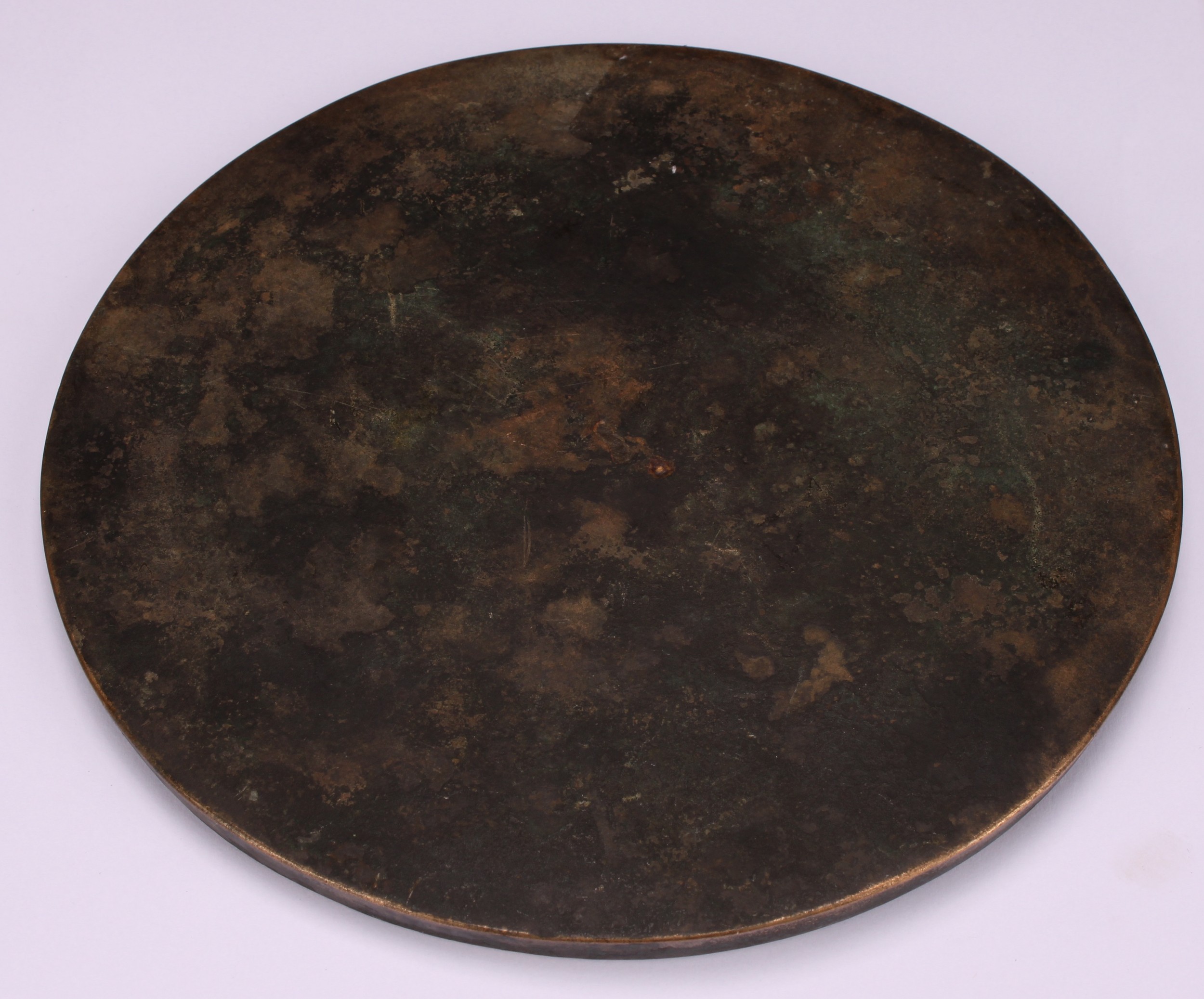 A Chinese bronze mirror, cast to verso with a band of characters, 16.5cm diam - Image 3 of 3