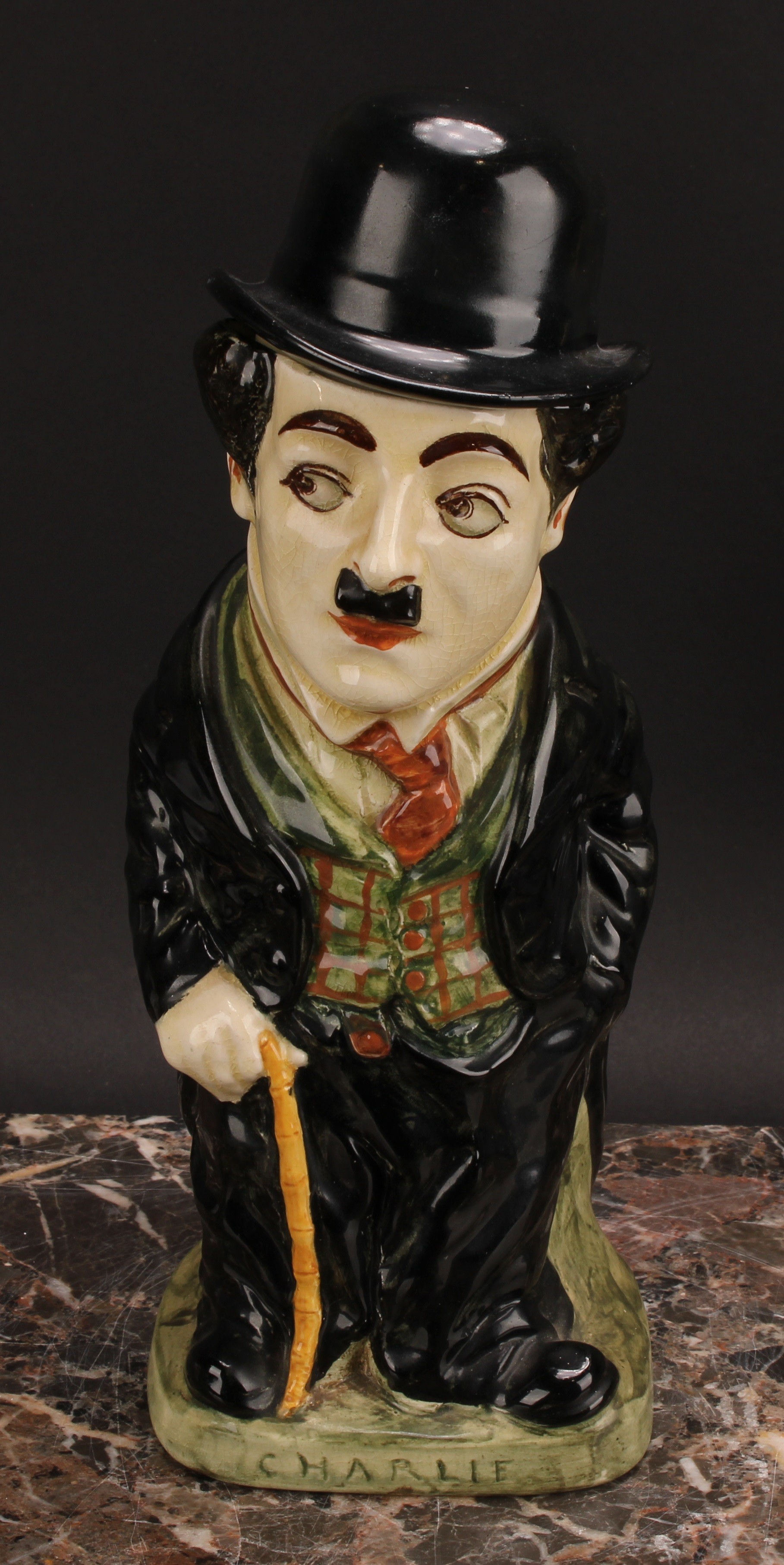 A Royal Doulton jug and cover, modelled as Charlie Chaplin, he stands wearing baggy black suit - Bild 2 aus 7