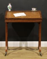 A Victorian rosewood writing desk, by Gillows of Lancaster and London, stamped GILLOWS and