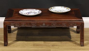 A Chinese hardwood low tea table, panel top, shaped apron carved with angular stylised clouds,