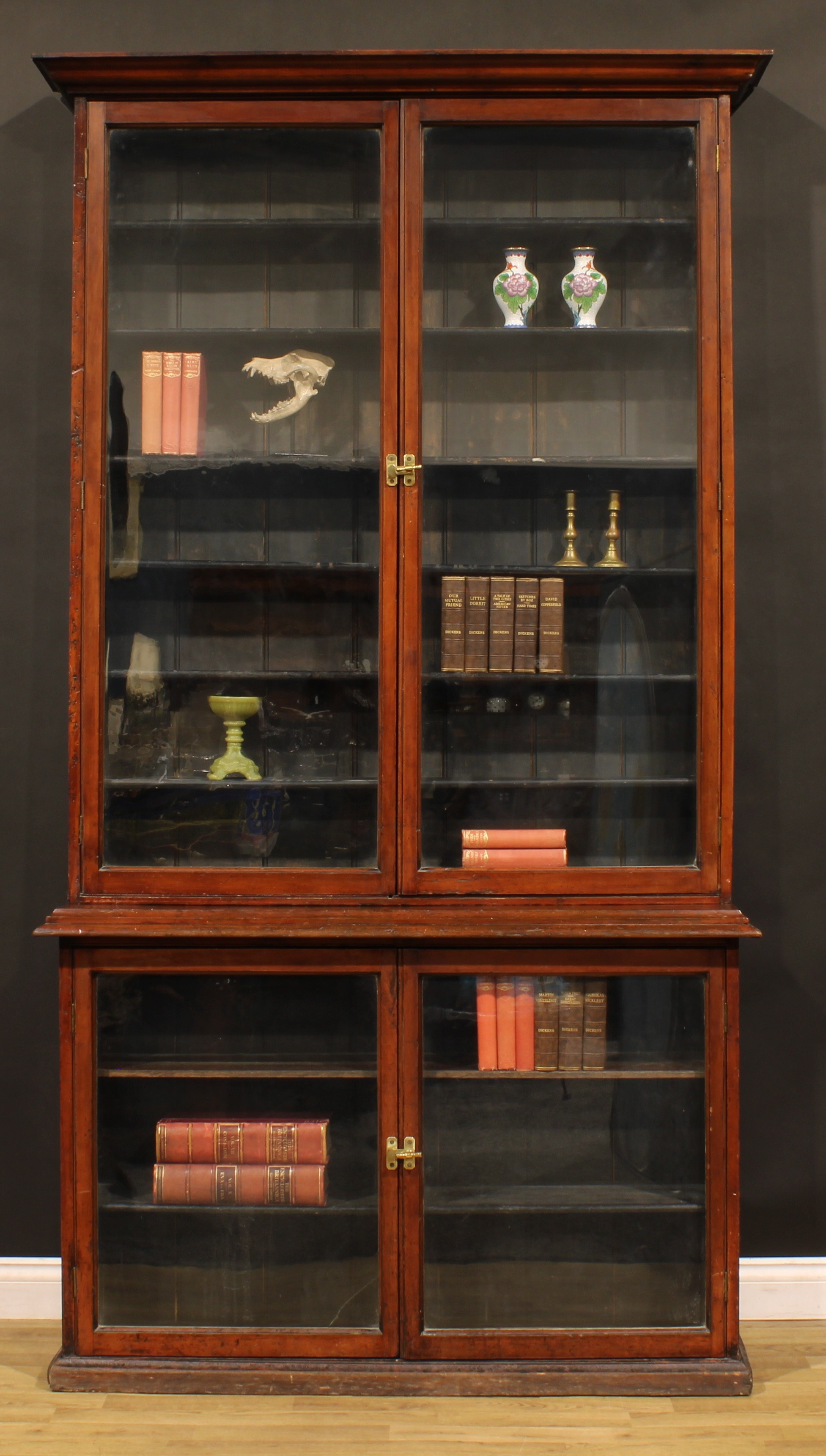 A late Victorian mahogany shop display case or library bookcase, moulded cornice above a pair of