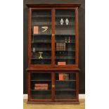 A late Victorian mahogany shop display case or library bookcase, moulded cornice above a pair of