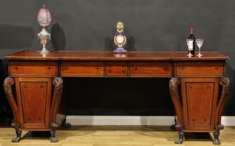 A substantial Regency mahogany twin pedestal sideboard or serving table, inverted break-centre