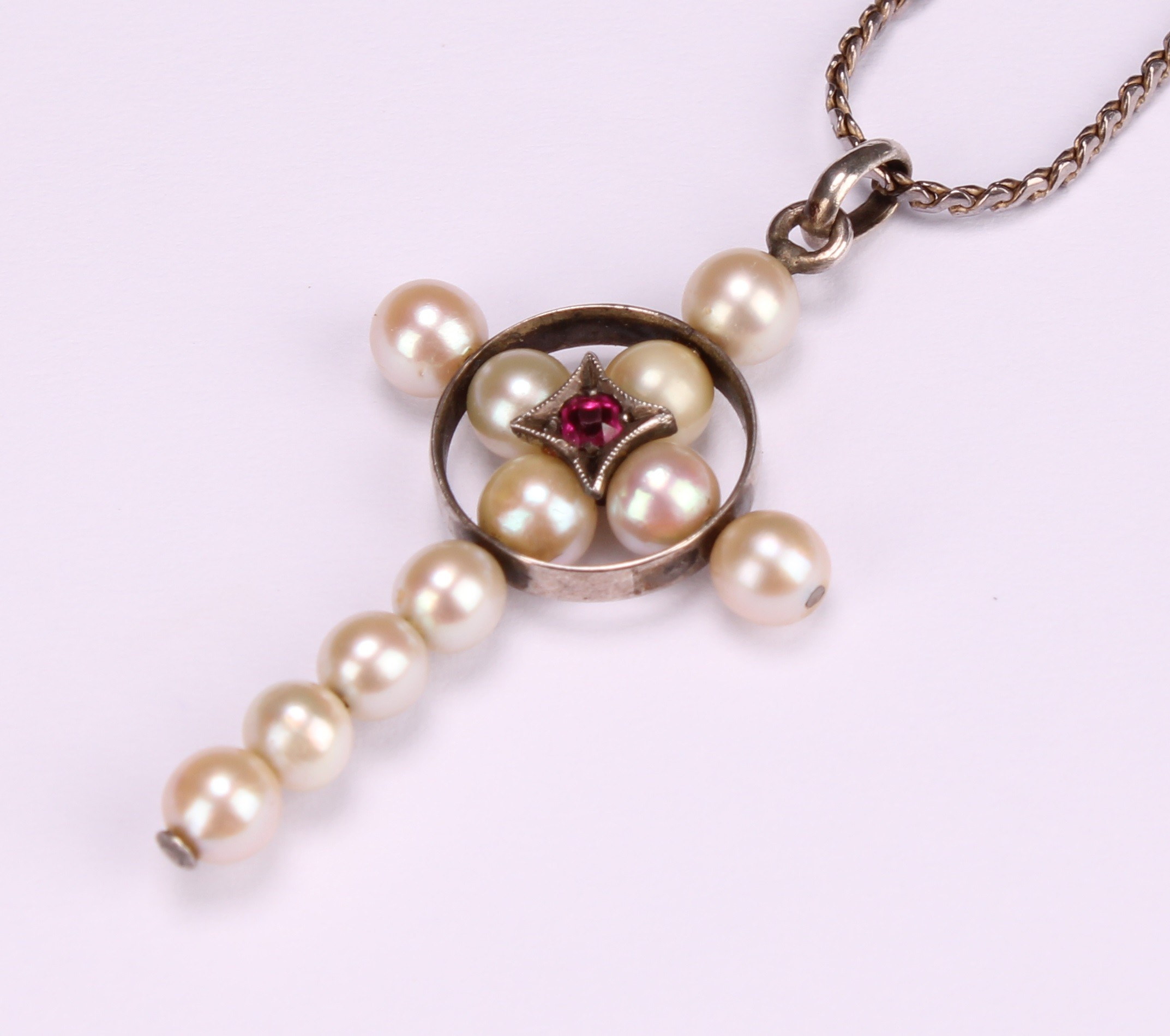 A natural pearl and spinel crucifix pendant, centred by a round cut pink stone, silver chain - Image 3 of 4