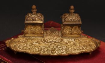 A 19th century gilt bronze inkstand, cast in the Renaissance Revival taste with masks, leafy