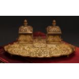 A 19th century gilt bronze inkstand, cast in the Renaissance Revival taste with masks, leafy