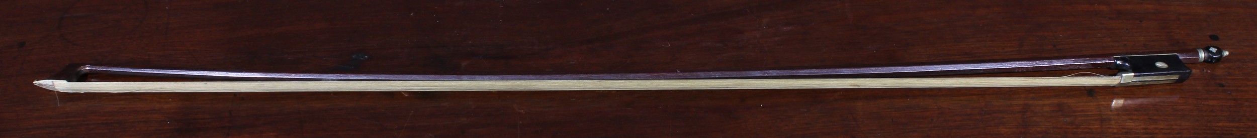 A violin bow, stamped Gebruder Muster Sch, No.2637, 74cm long