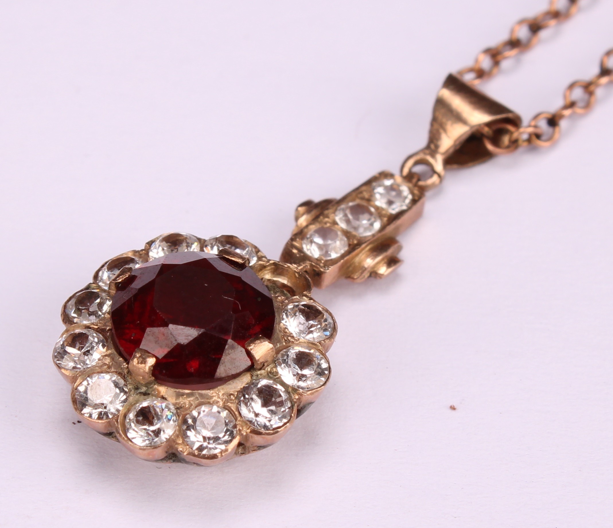 A red garnet and white stone cluster pendant, rose metal mount, suspended from a 9ct gold chain, - Image 3 of 5