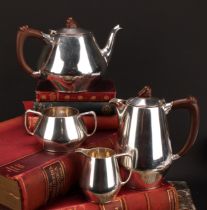 An Art Deco style silver four piece tea service, comprising teapot, hot water pot, milk jug and