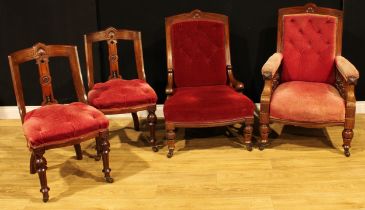 A late Victorian walnut composed four-piece drawing room suite, comprising armchair, withdrawing
