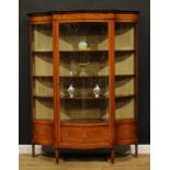 A Sheraton Revival satinwood and marquetry serpentine display cabinet, moulded cornice with