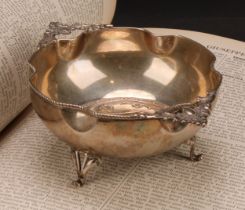An early 20th century Continental silver two handled dish, embossed with the astrological symbols