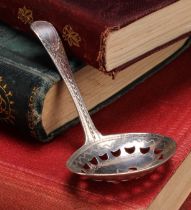 A George III silver caddy spoon, pierced oval bowl, bright-cut and wrigglework engraved, 7.5cm long,