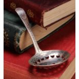 A George III silver caddy spoon, pierced oval bowl, bright-cut and wrigglework engraved, 7.5cm long,