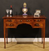 A Sheraton Revival satinwood banded mahogany serpentine serving table, oversailing top above five