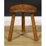 Robert Thompson, Mouseman of Kilburn, an oak milking stool, carved mouse signature, 35.5cm high,