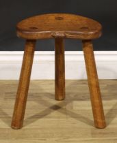 Robert Thompson, Mouseman of Kilburn, an oak milking stool, carved mouse signature, 35.5cm high,