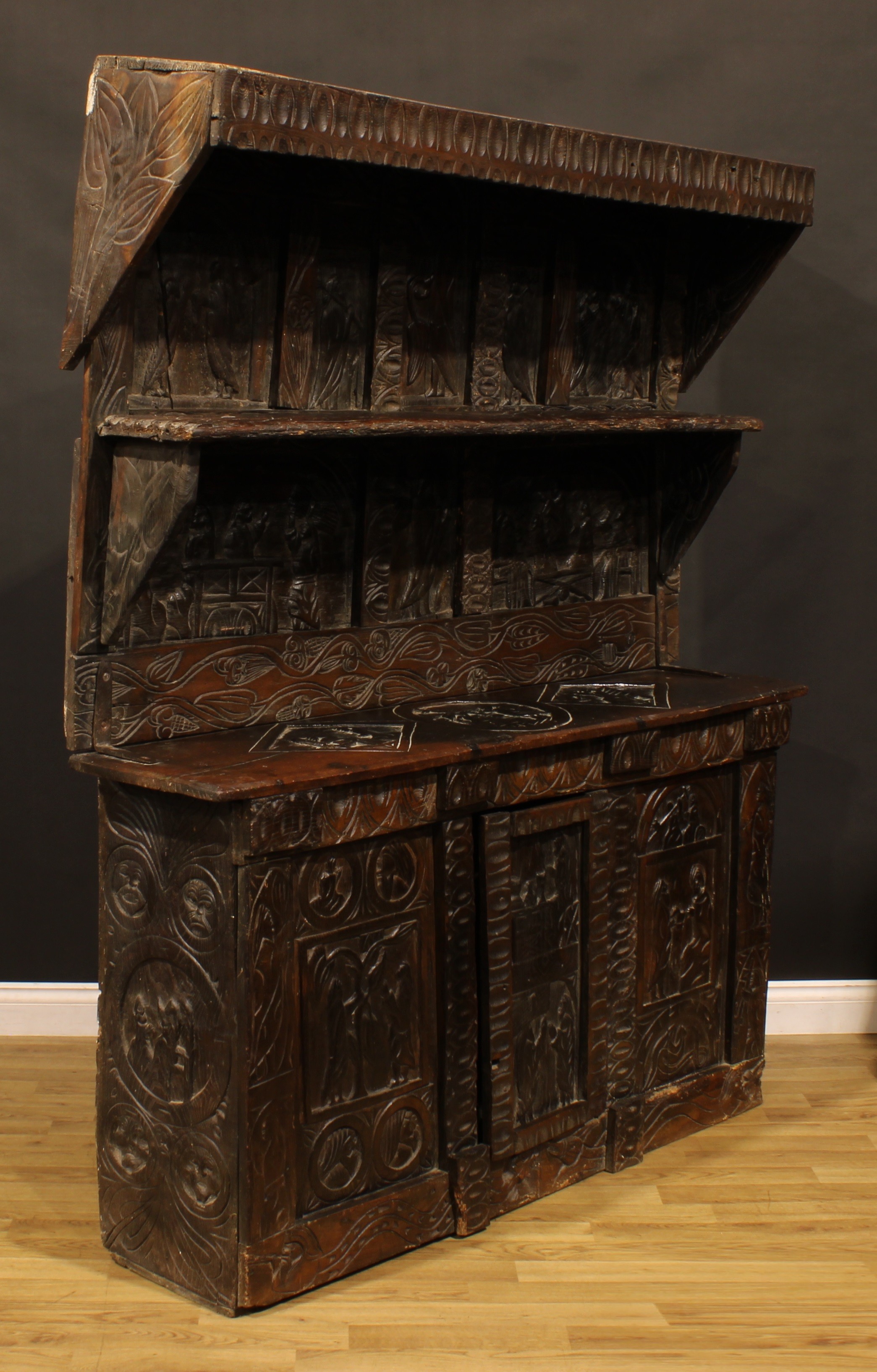 A 17th century style ecclesiastical Historicist Revival oak dresser or side cabinet, carved - Image 3 of 4