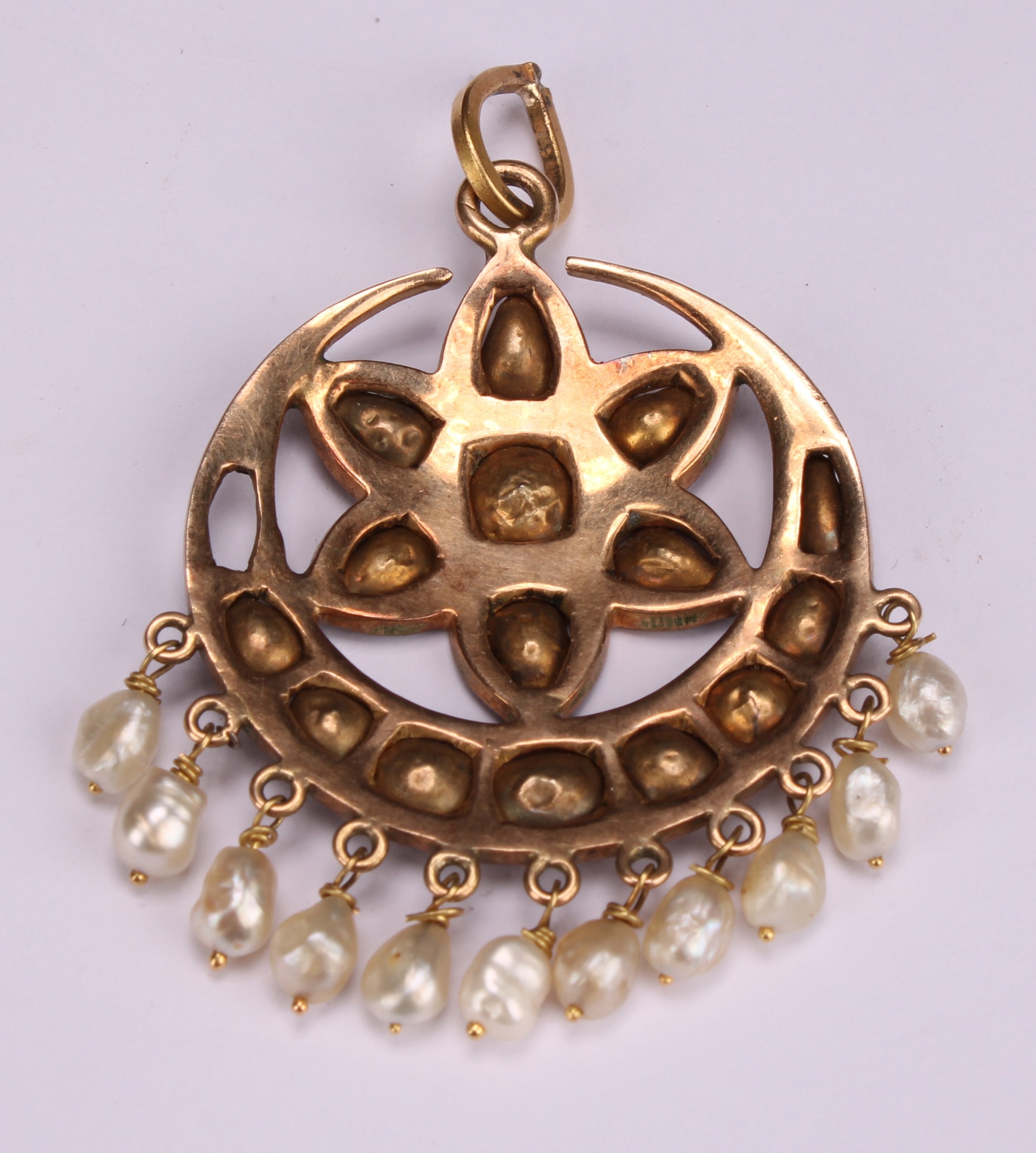 An unmarked Indian gold pendant set with a starburst arrangement of old cut diamonds, above a - Image 3 of 3