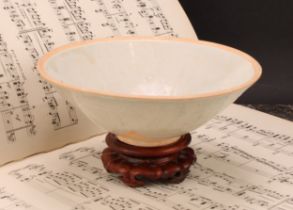 A Chinese Sung type celadon circular bowl, the centre moulded with lotus flower, 17cm diameter, 19th