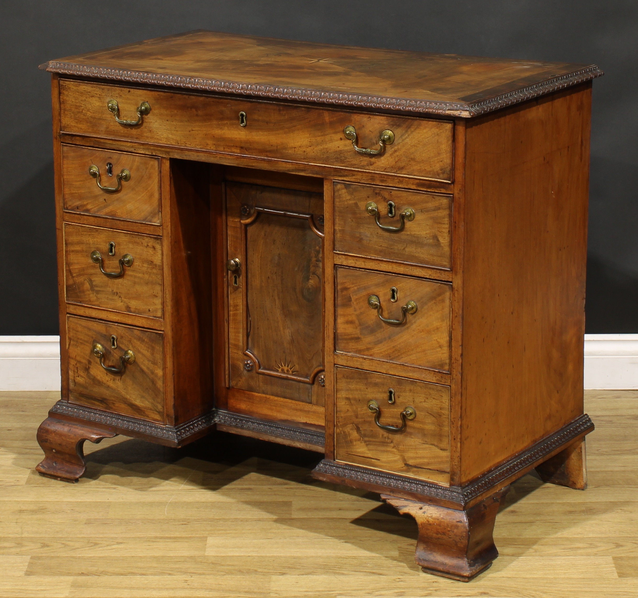 A George III mahogany kneehole desk, rectangular top with moulded foliate carved edge centred by a - Image 5 of 6