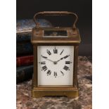 An early 20th century lacquered brass carriage clock, 6.5cm rectangular dial inscribed with Roman