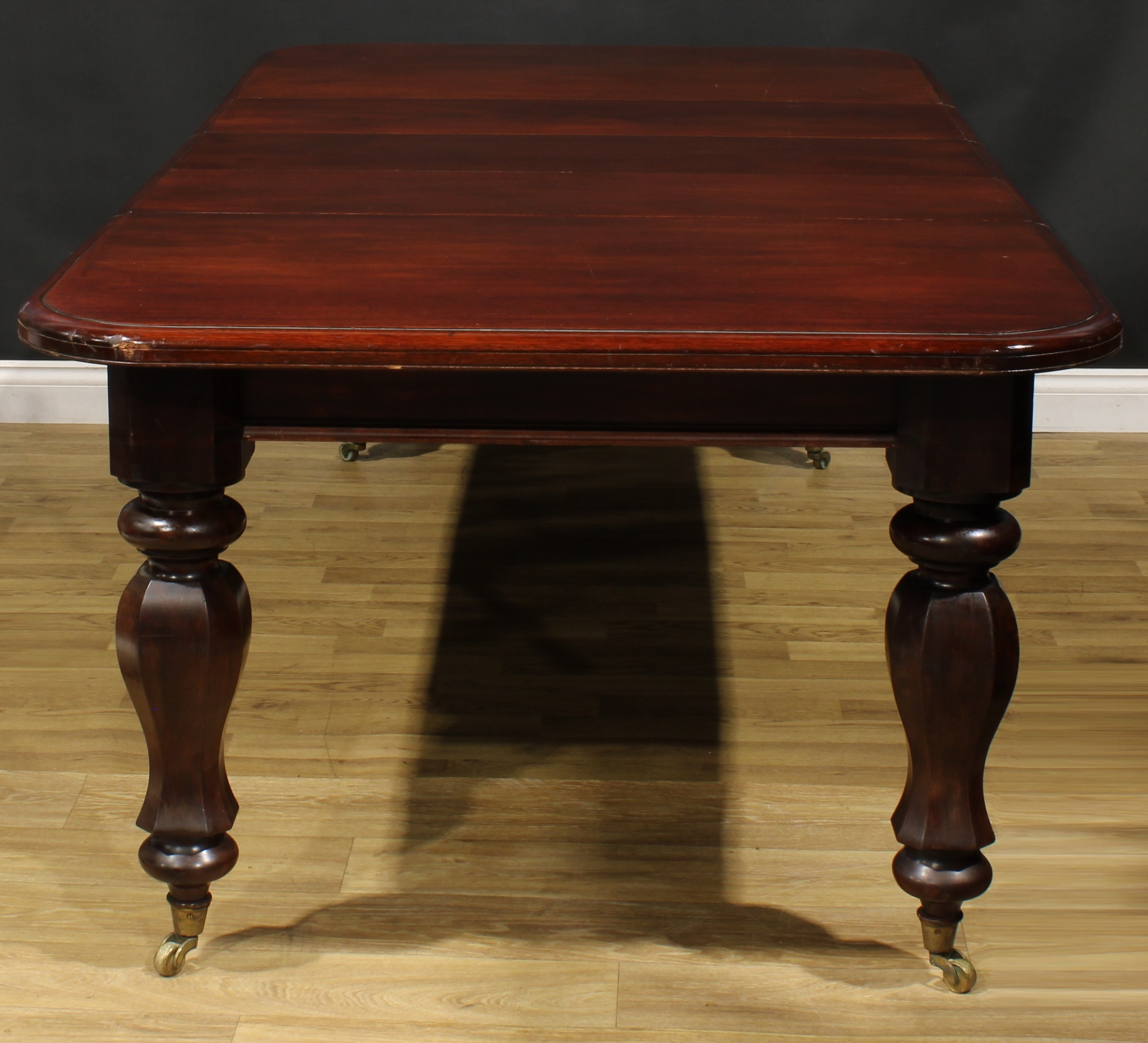 An early Victorian mahogany extending dining table, rounded rectangular top with moulded edge and - Image 2 of 3