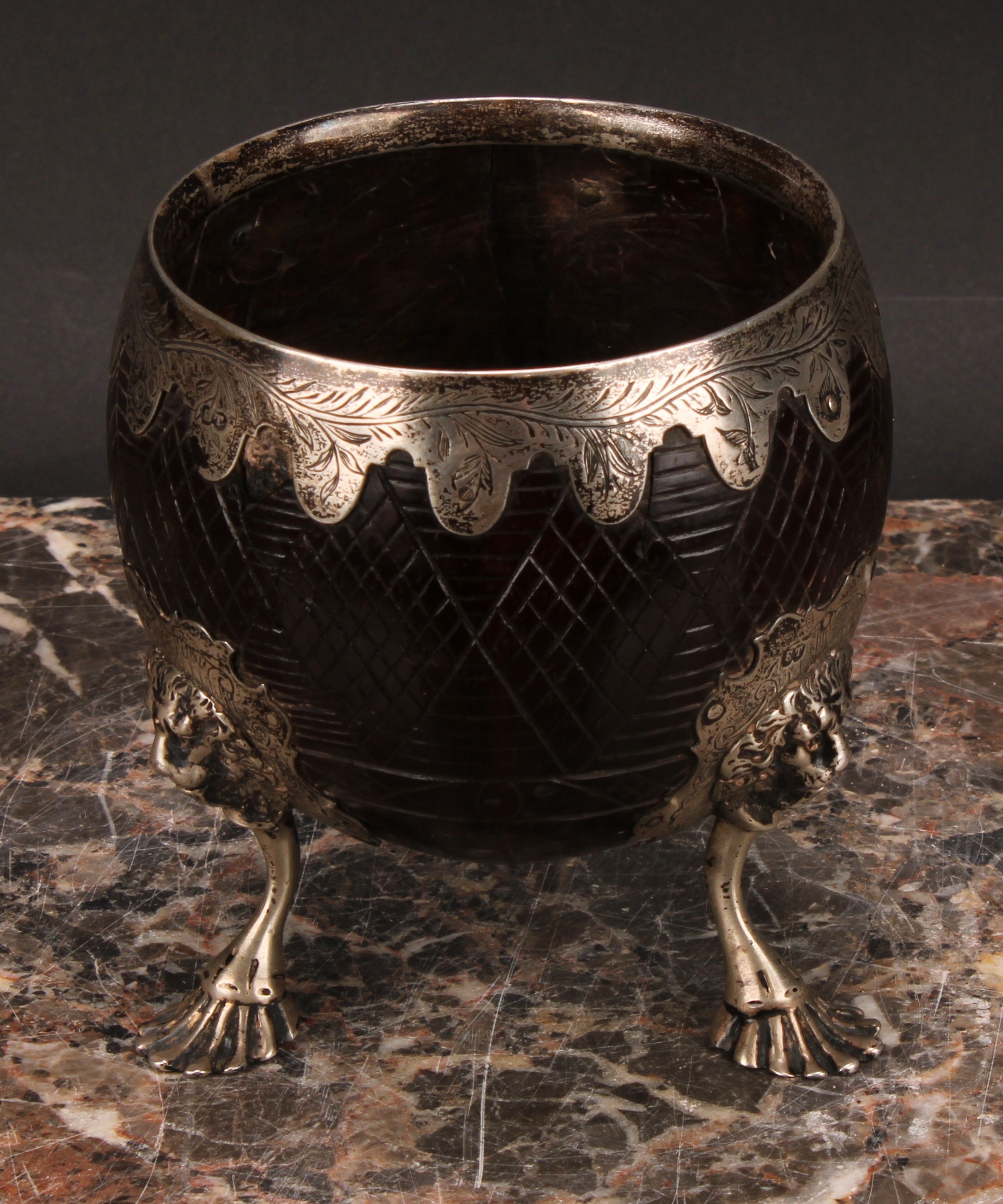 A George III silver mounted coconut cup, the fittings engraved with leafy stems, on a hatched - Image 2 of 4