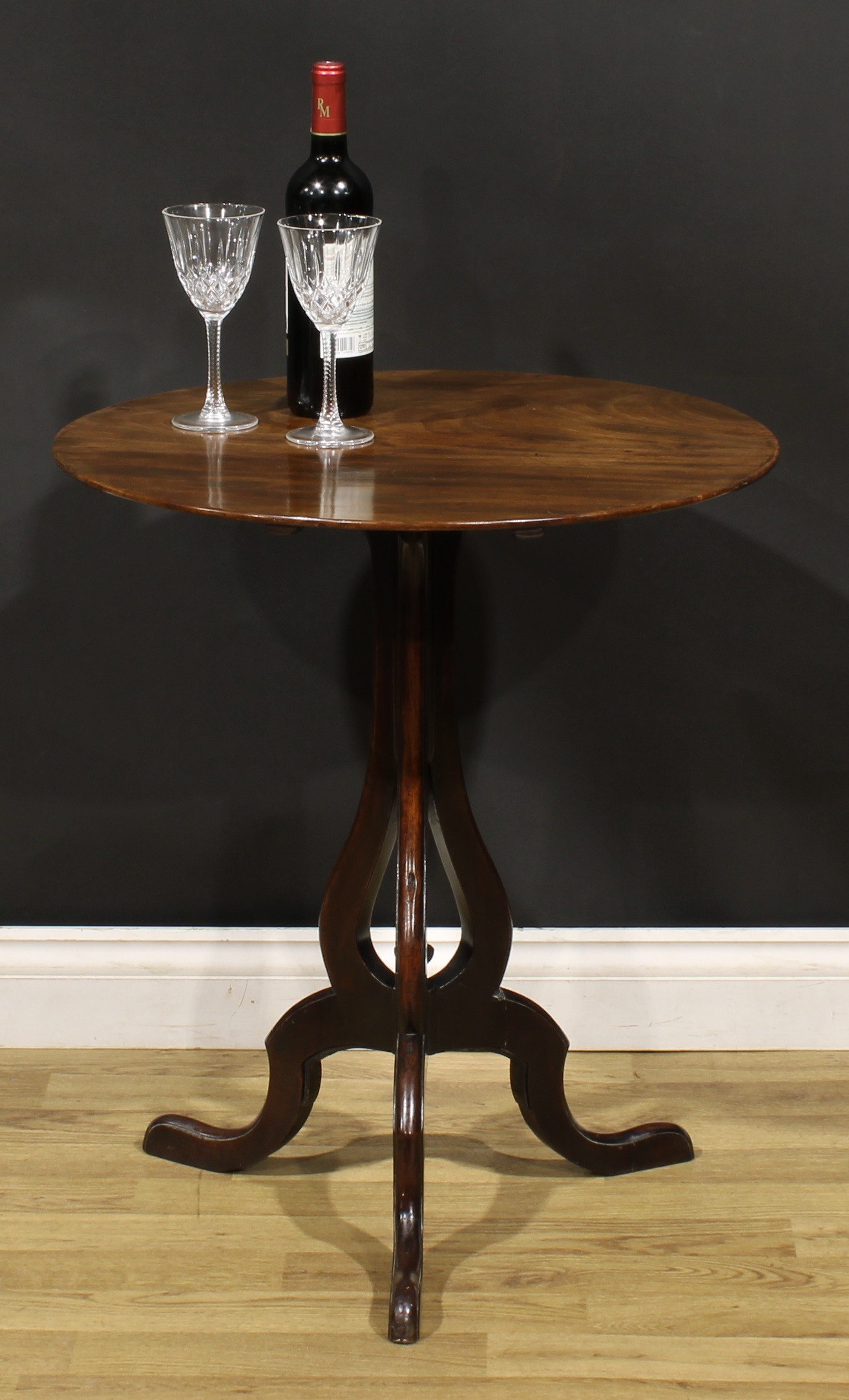 A George III mahogany tripod table, based on a design by Thomas Chippendale, circular tilting top,