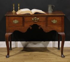 An unusually large 18th century oak lowboy, rectangular top with moulded edge above three frieze