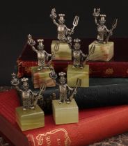 A set of six Italian silver novelty menu holders, each as a chef, onyx bases, 6cm high, cased