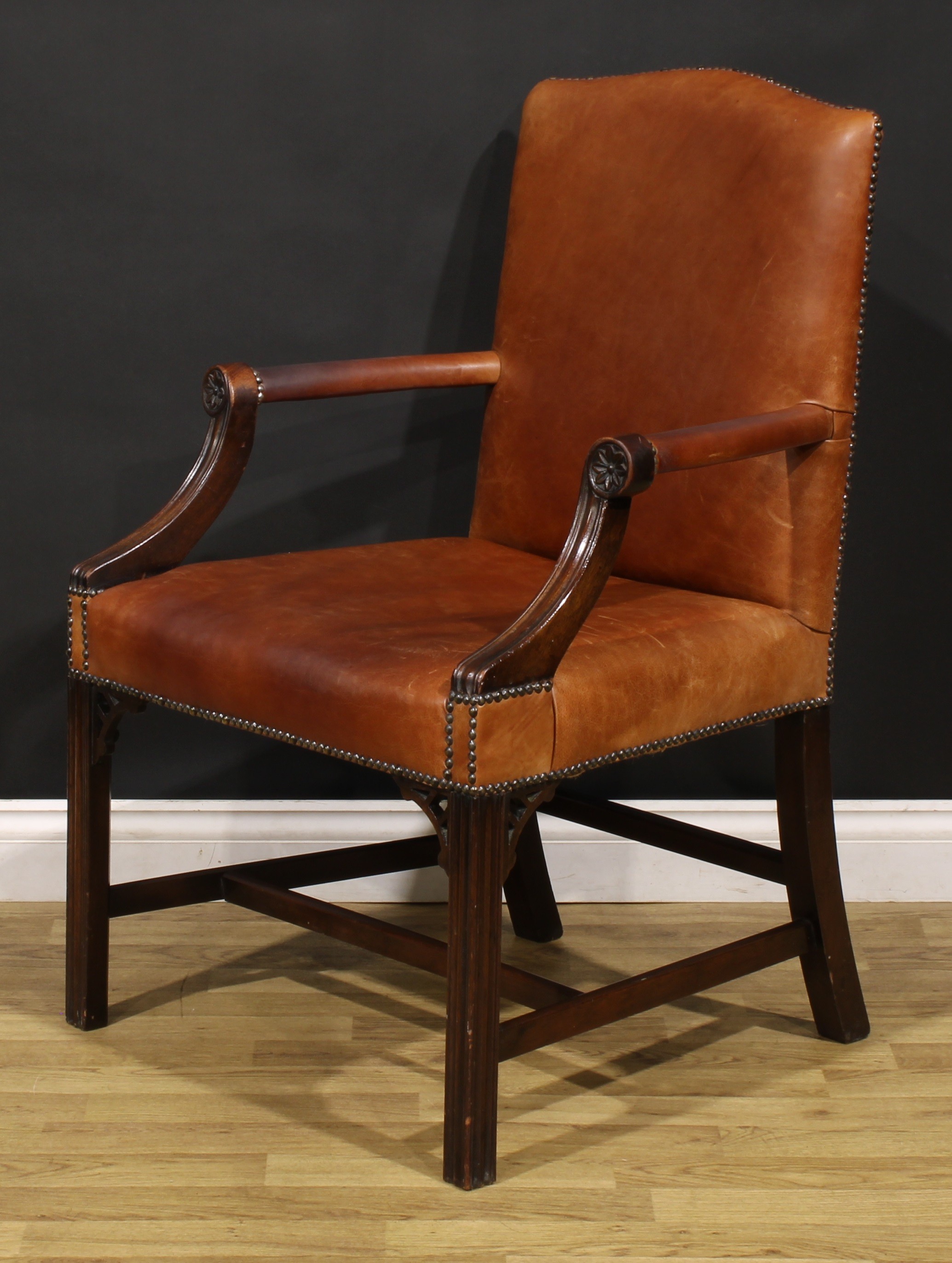 A Chippendale Revival mahogany Gainsborough armchair, stuffed-over leather upholstery, the hand - Image 3 of 4