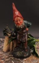 An Austrian terracotta gnome, by Johann Maresch, he stands, beside a barrel, holding a bowling wood,