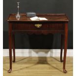 A George II mahogany silver table, dished rounded rectangular top above a long frieze drawer, shaped