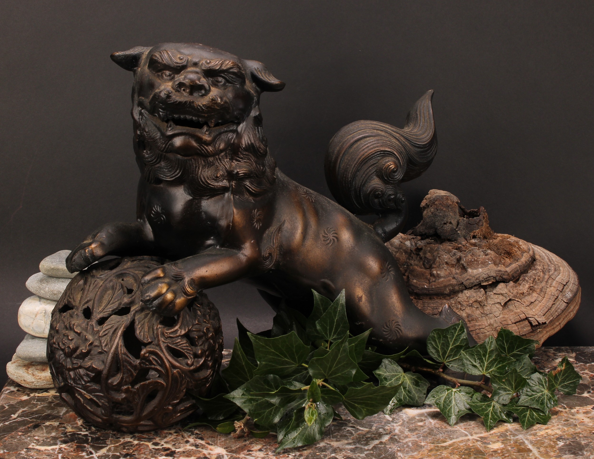 A Japanese bronzed metal koro or incense burner, as a Chinese guardian lion, 32.5cm high