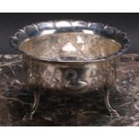 An Irish Provincial silver bowl, chased with a bird, a rabbit, a dog and a swan, in a landscape,