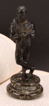 A late 19th century Grand Tour patinated bronze, of Hercules, draped with a pelt, masked club in
